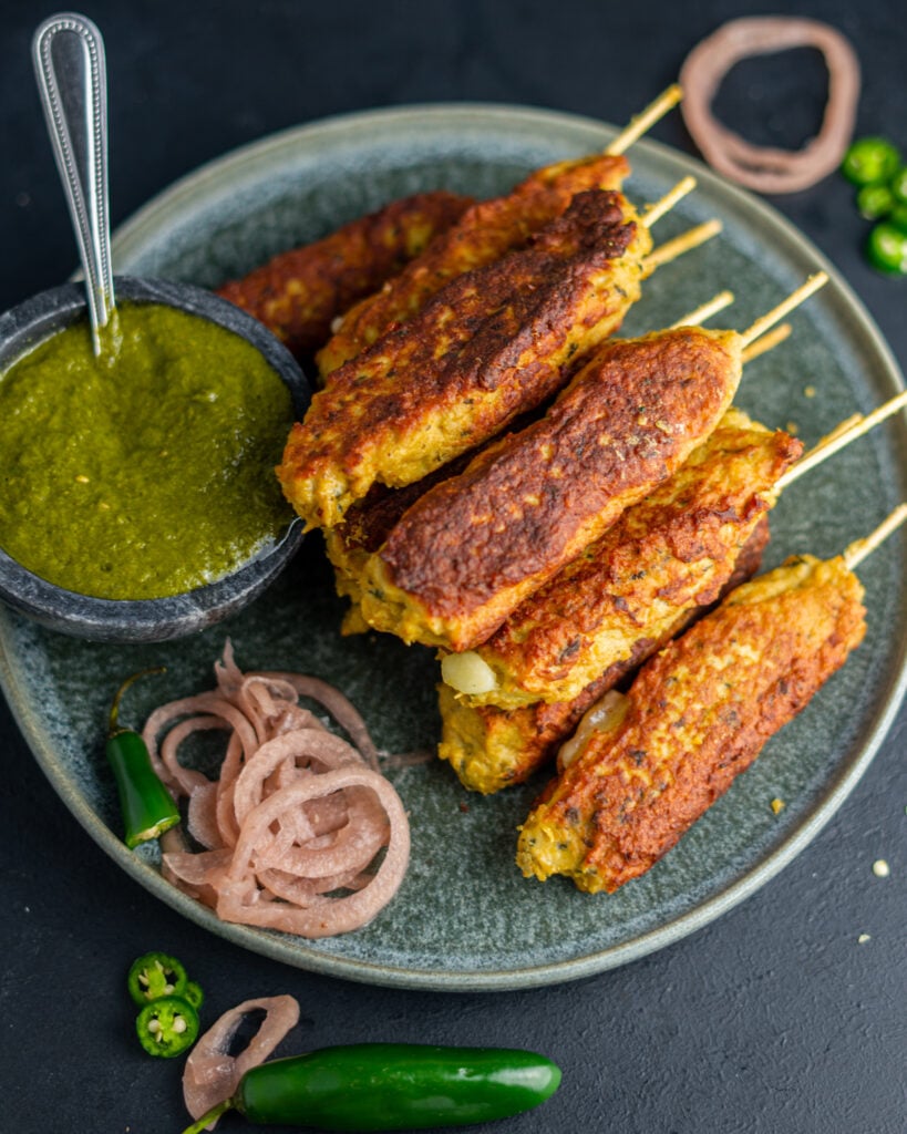 Chicken Seekh Kebabs cilantro mint chutney and pickled onions