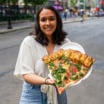 Shweta with Giant Pizza Slice from Champions Pizza with Garlic Knot Crust