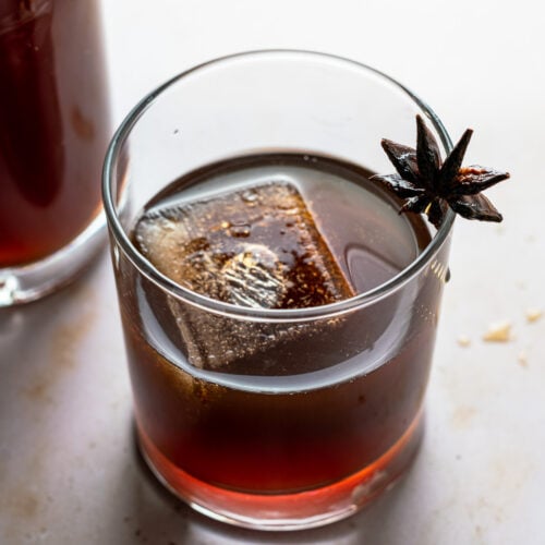 Chai Liqueur in glass with star anise garnish