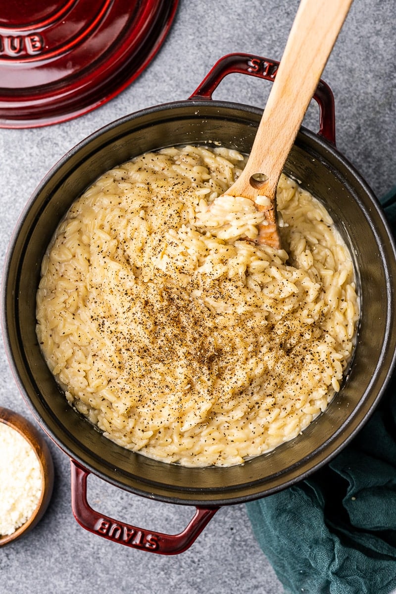 Cacio e Pepe Orzo in Staub Cocotte with pecorino cheese on the side