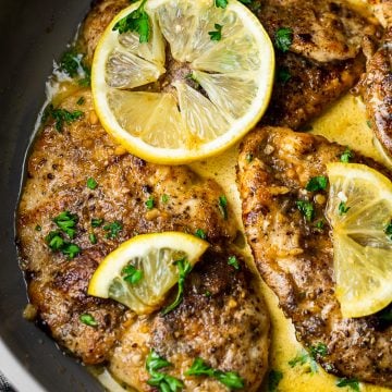 Creamy Garam Masala Lemon Butter Chicken in Pan close up on one piece of chicken