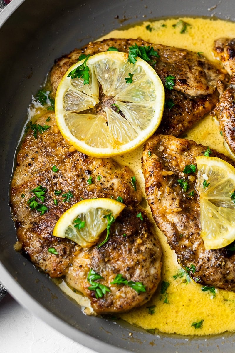 Creamy Garam Masala Lemon Butter Chicken in Pan close up on one piece of chicken