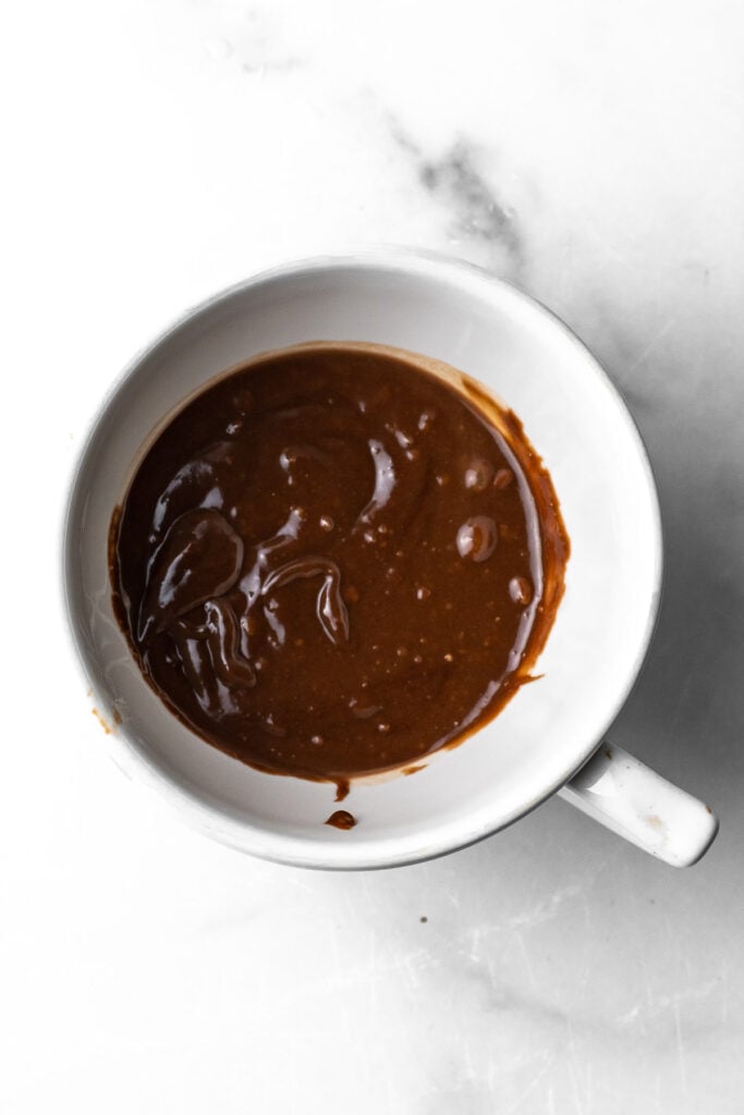 nutella lava mug cake batter in a mug
