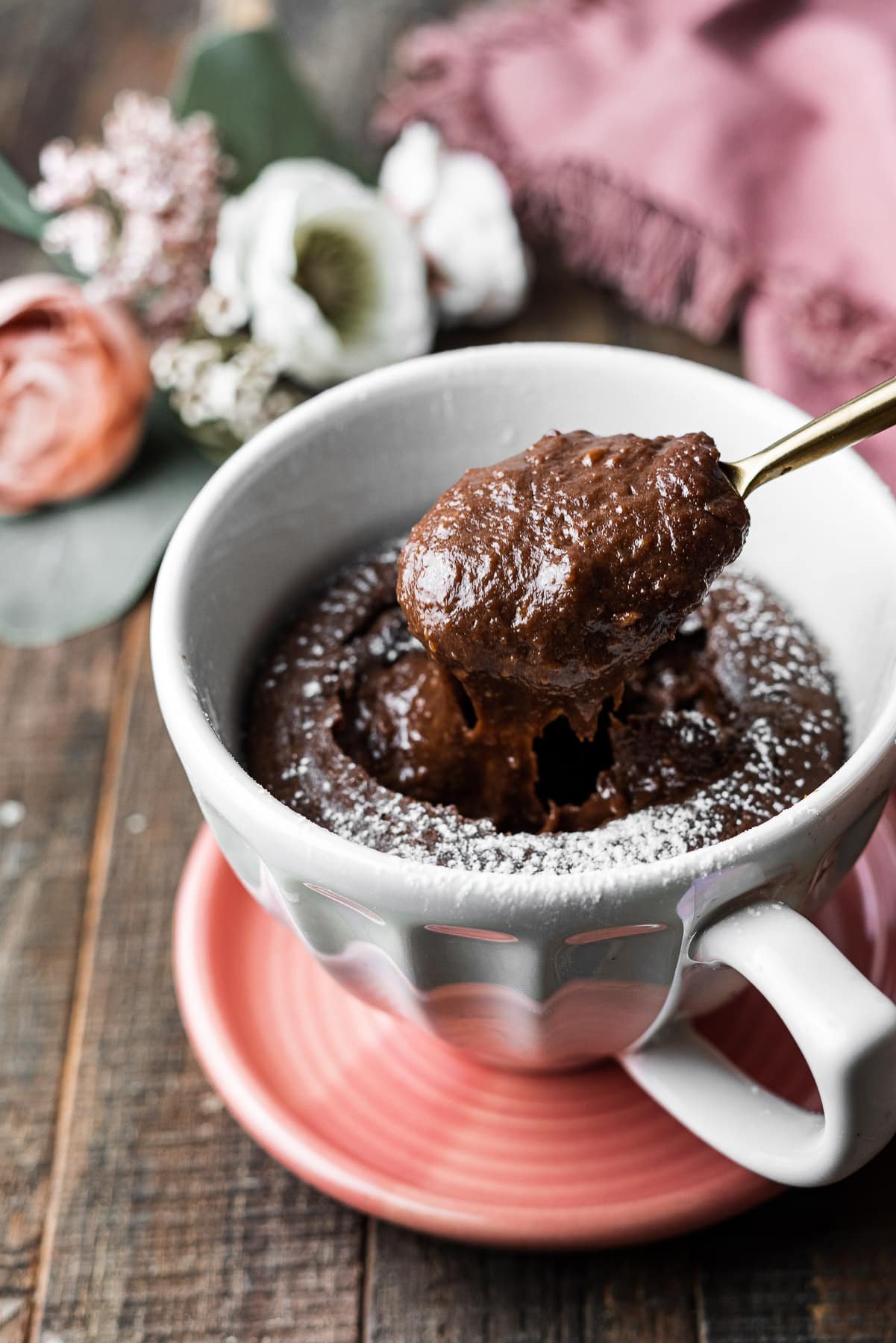 nutella lava mug cake spooning up the molten lava center