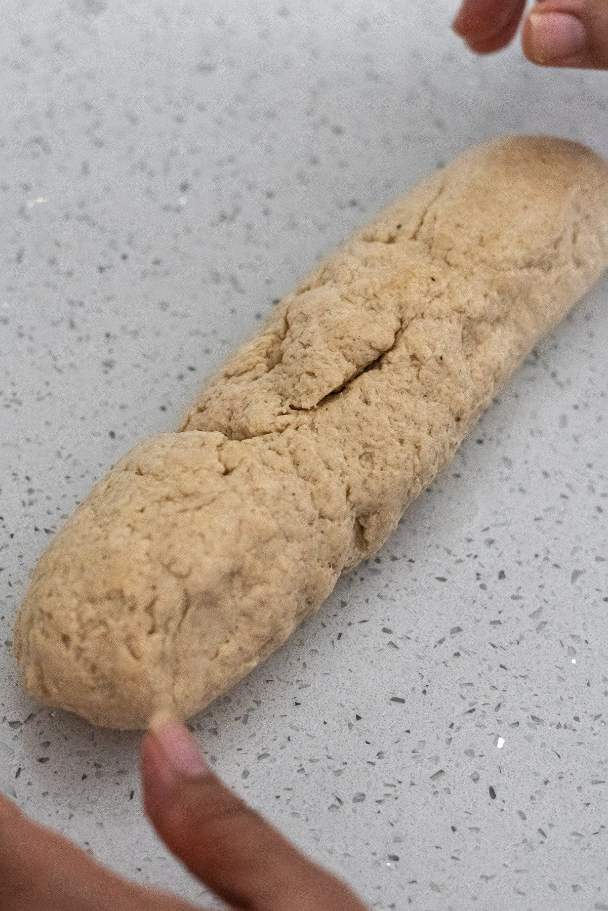 bhatura dough formed into a log.