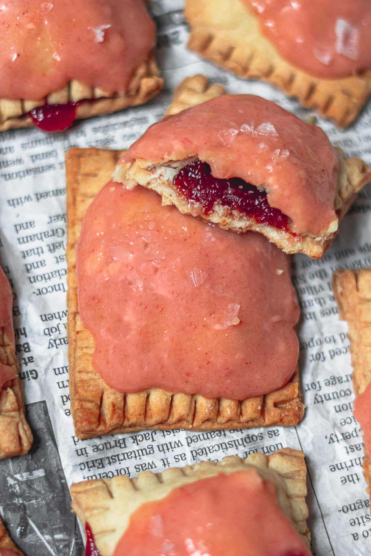 Guava Cream Cheese Poptarts with one broken in half to reveal the guava paste