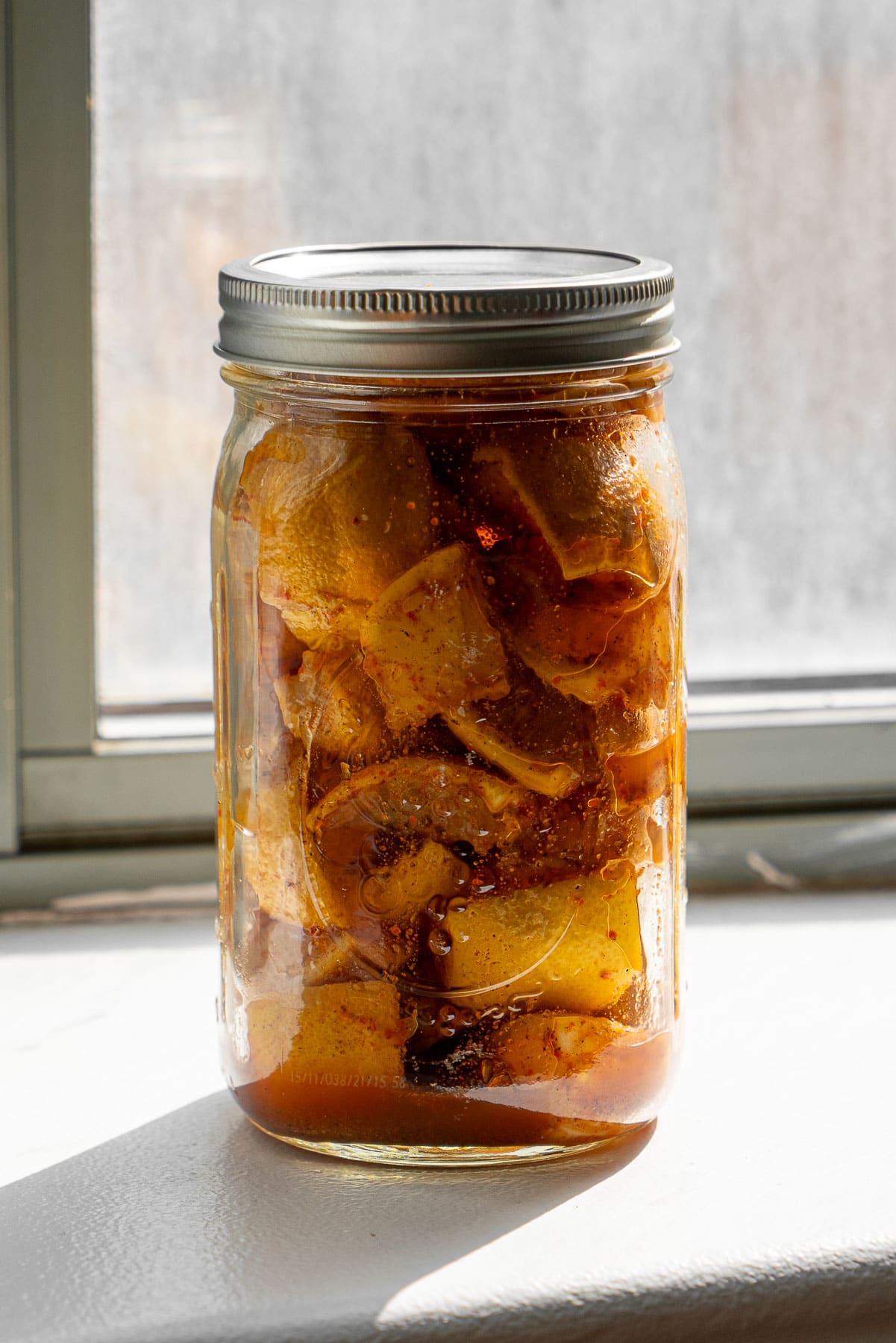 Spicy Lemons sun fermenting on a windowsill.