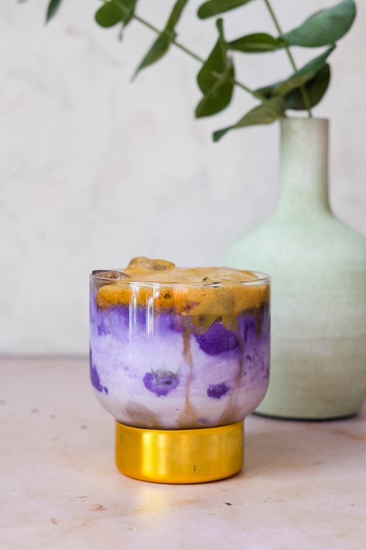 ube with milk and instant espresso in a highball glass