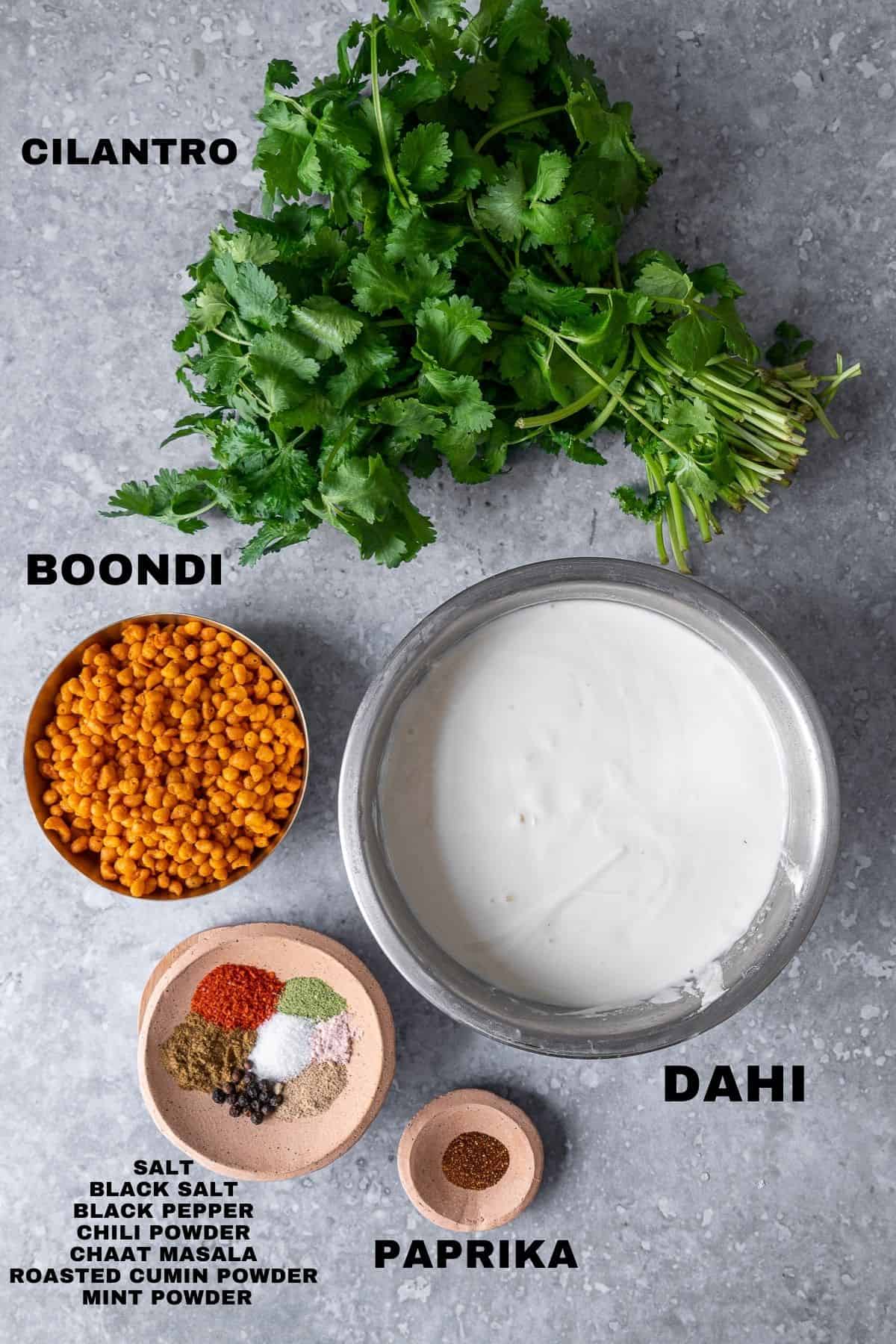 flatlay of boondi raita ingredients with labels