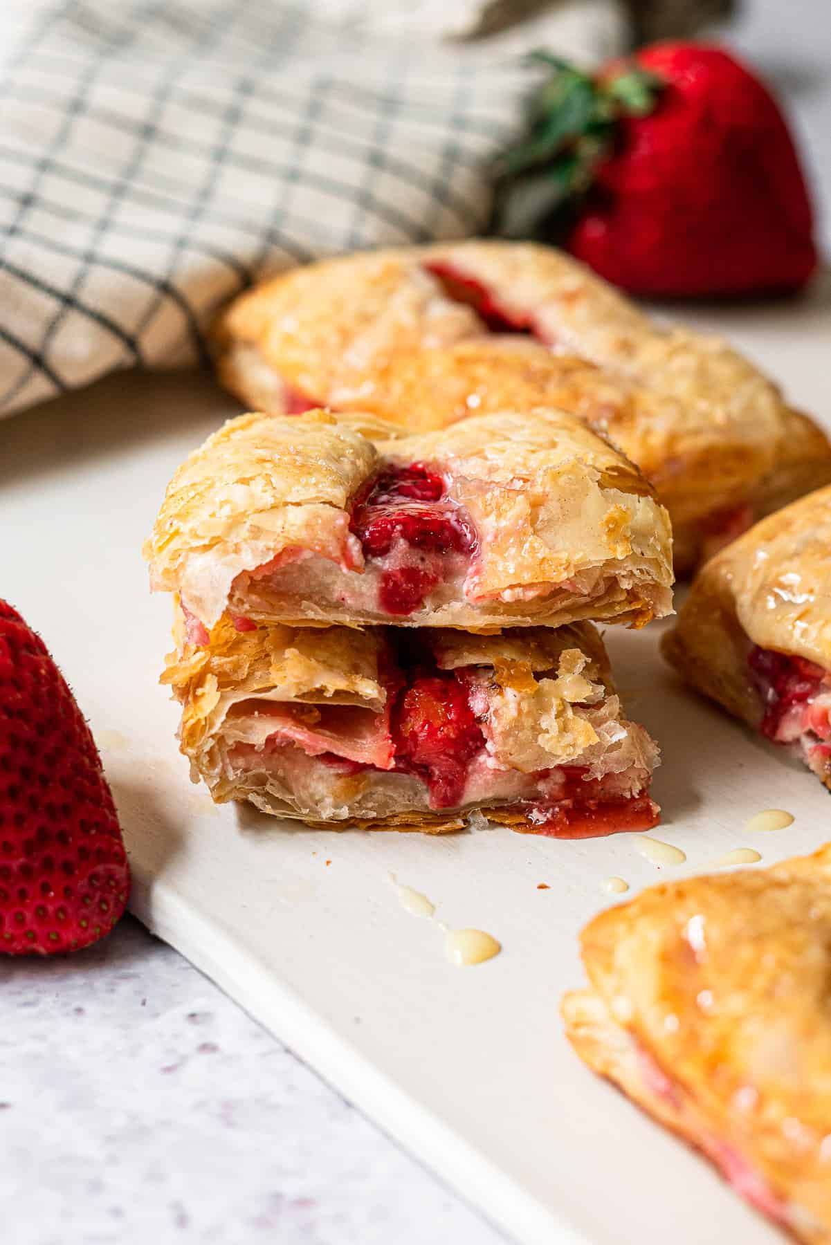 strawberry turnover cut in half and stacked to reveal the cross section