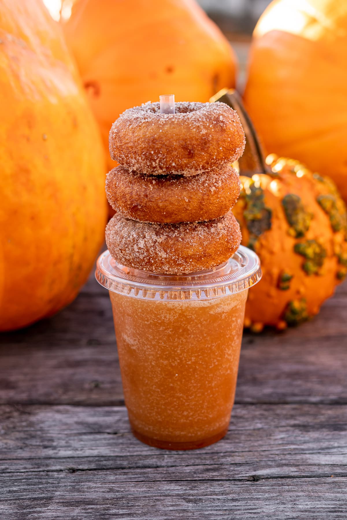 apple cider slushie with a stack of donuts on top