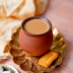 masala chai in a platter with parle g cookies