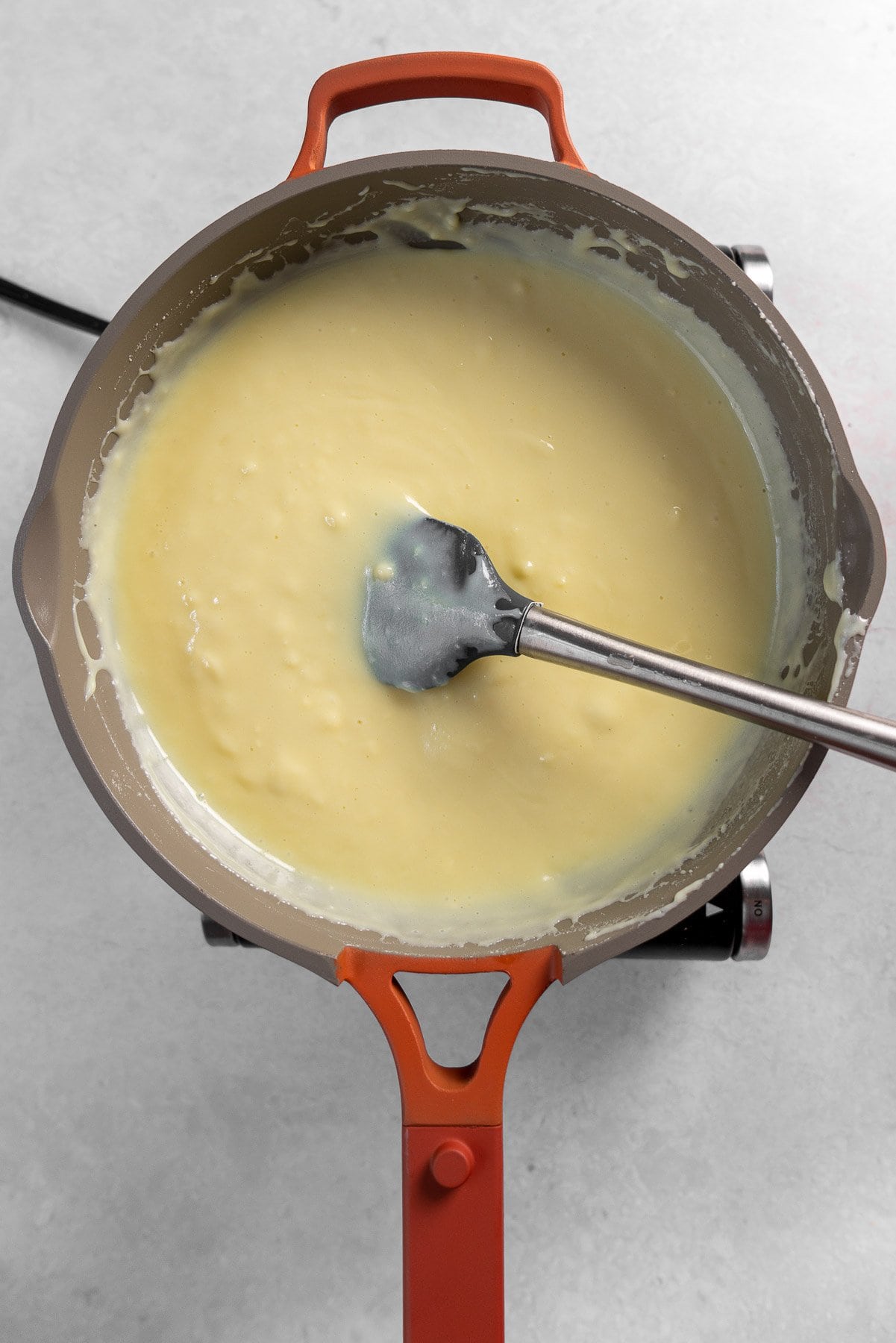 white barfi batter in a pan, unreduced