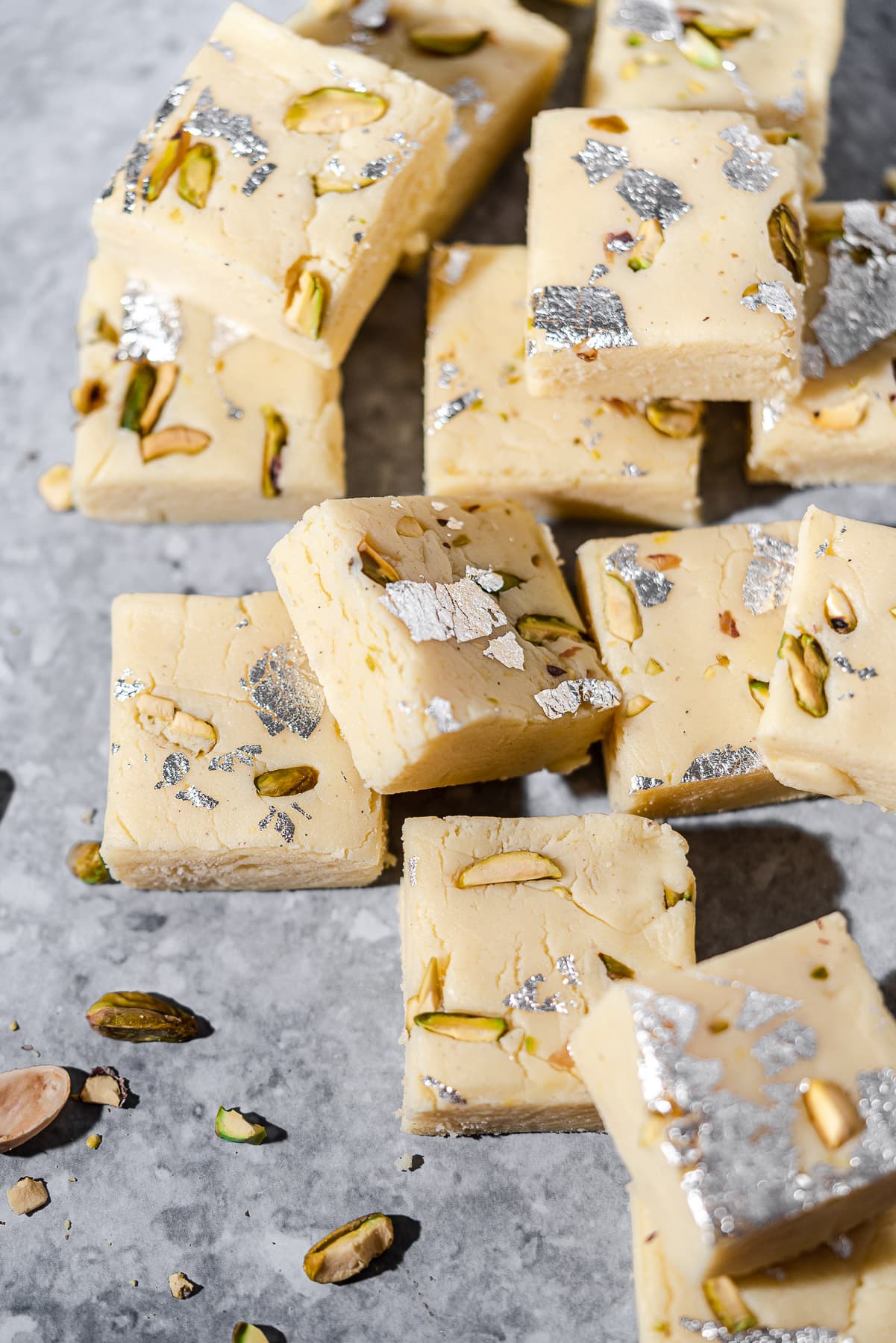 pile of barfi with chopped pistachio