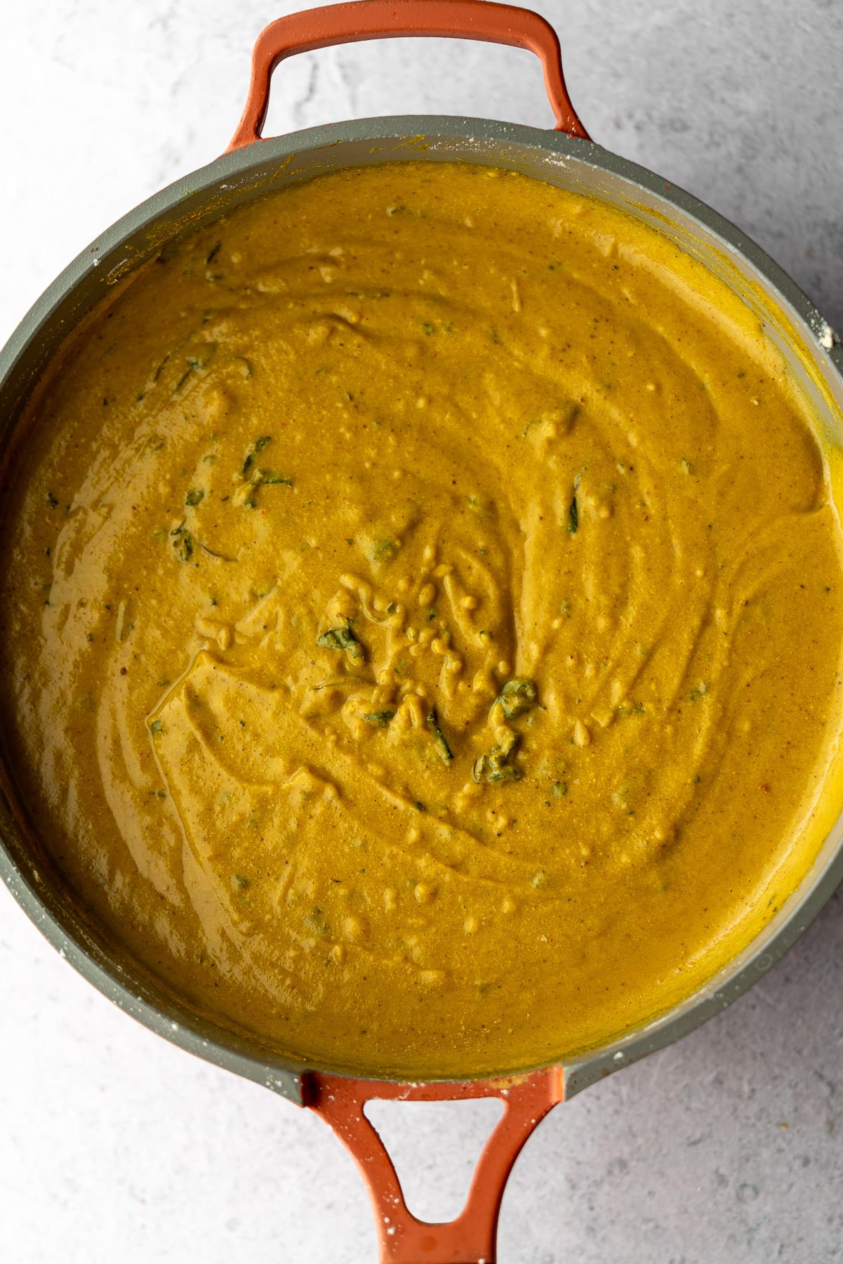 pan filled with rehydrated chickpea flour and spices