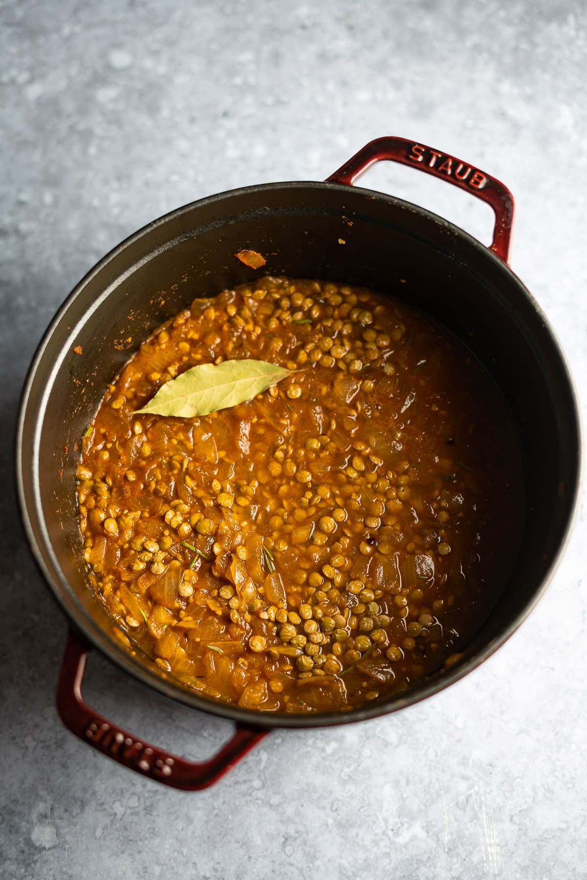 lentils in a staub cocotte ready to be cooked