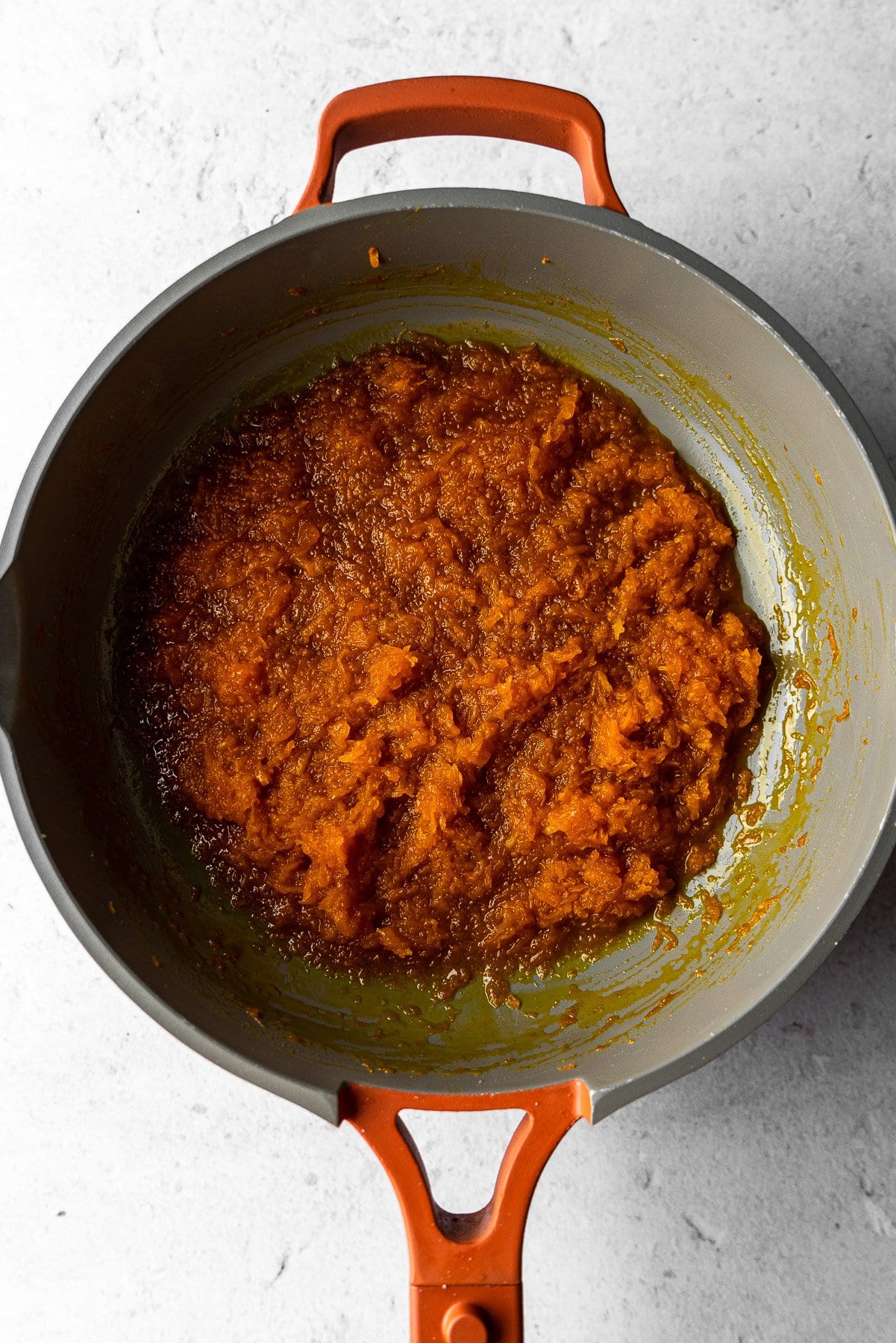 watery pumpkin halwa simmering in a pan