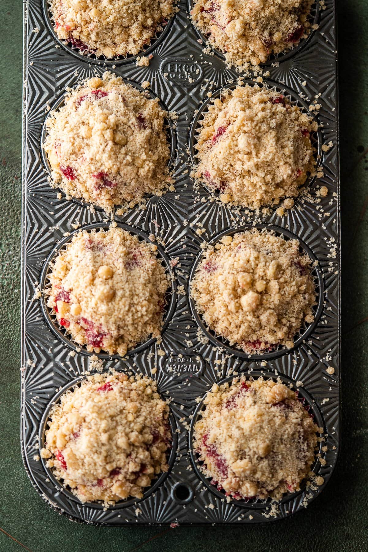 ovenex muffin pan with cranberry sauce coffee cake muffin crumbles unbaked
