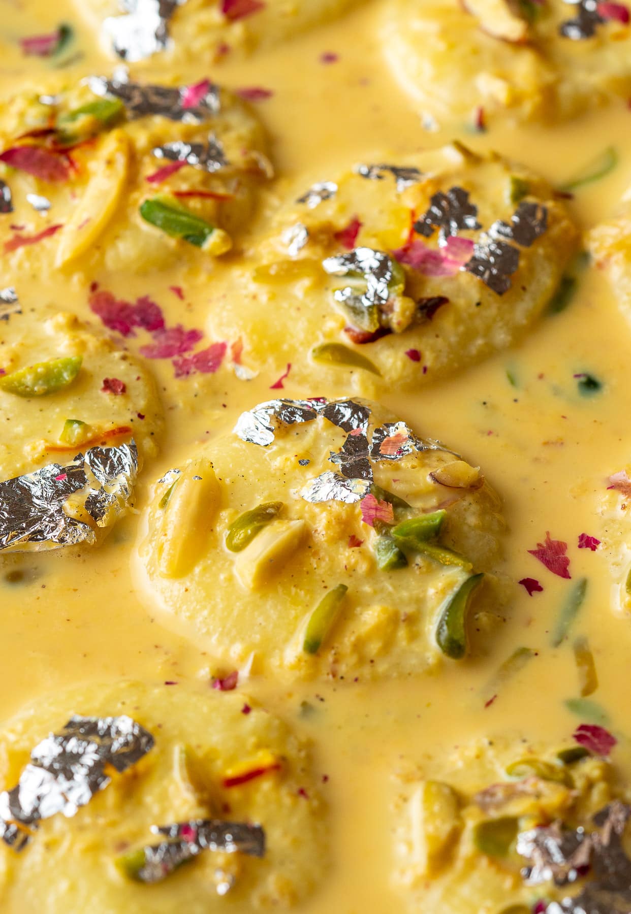 up close shot of ras malai in saffron malai