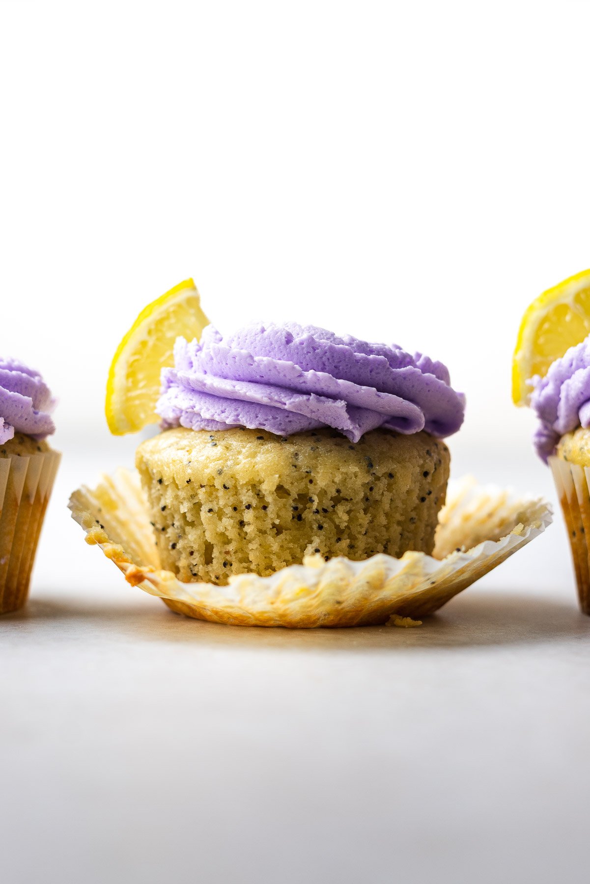 straight on shot of one lemon poppyseed cupcake