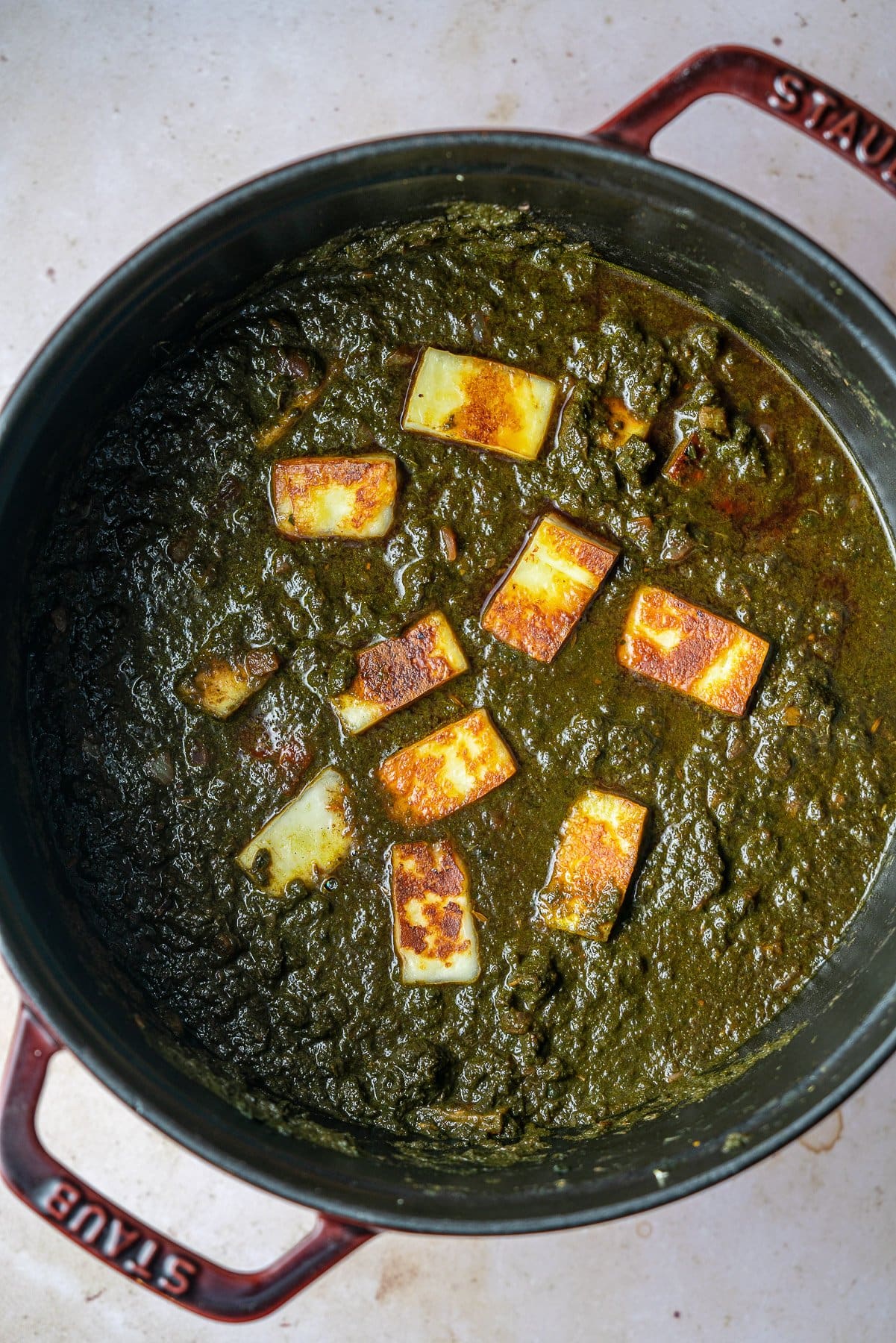 finished saag paneer in a staub cocotte