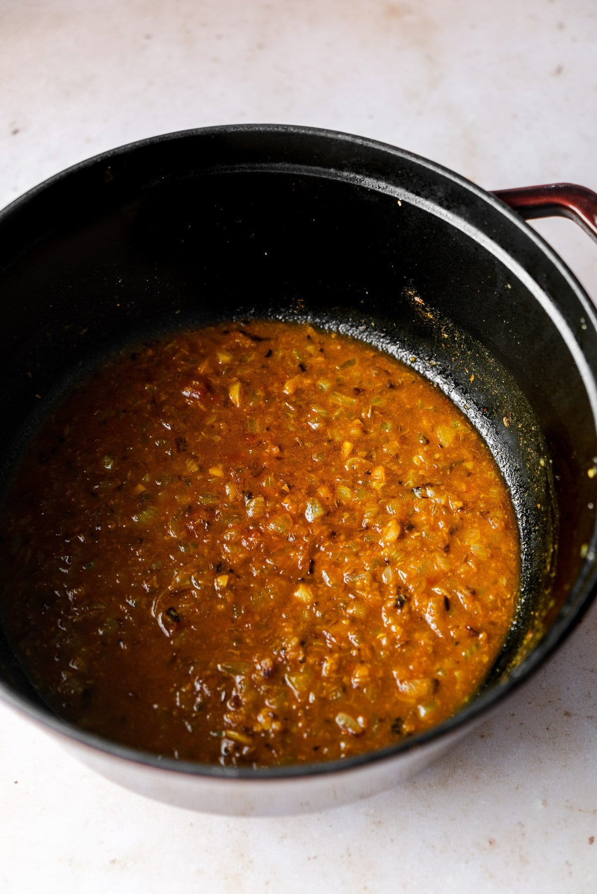 tomato and onion gravy for saag paneer in a cocotte