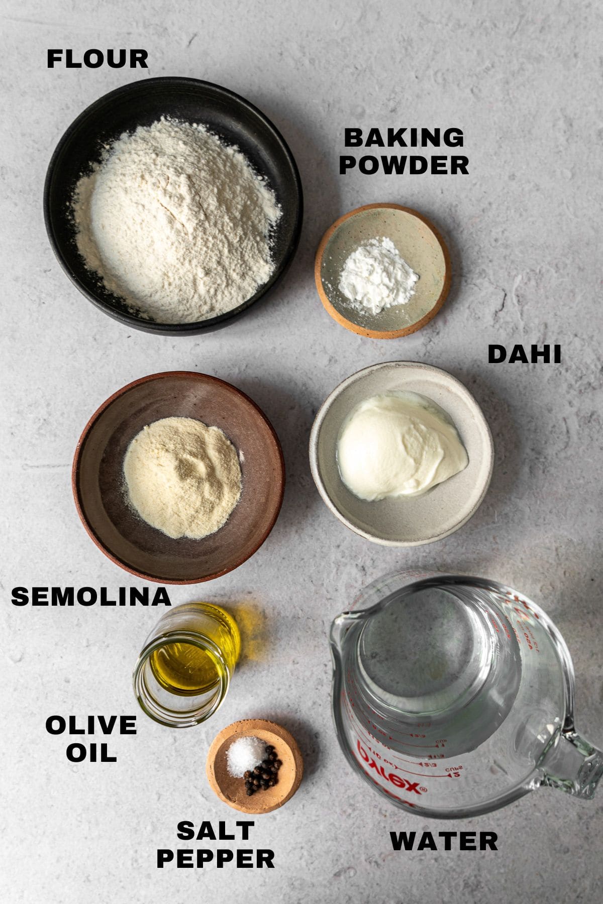 Flatlay of ingredients for bhatura with ingredient labels.