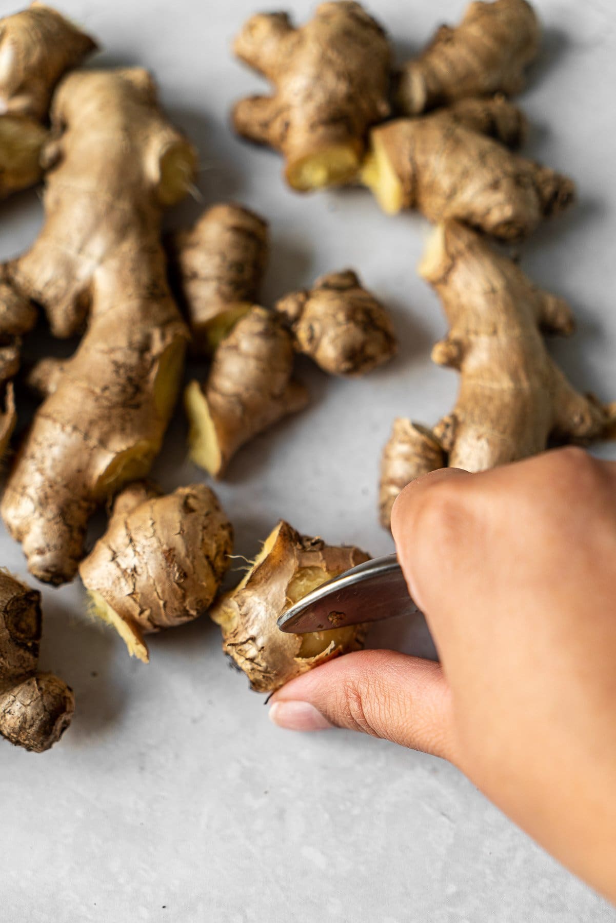 Peeling Ginger with a spoon.