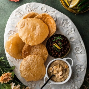 Halwa, puris, and chana in a decorative platter for Navratri