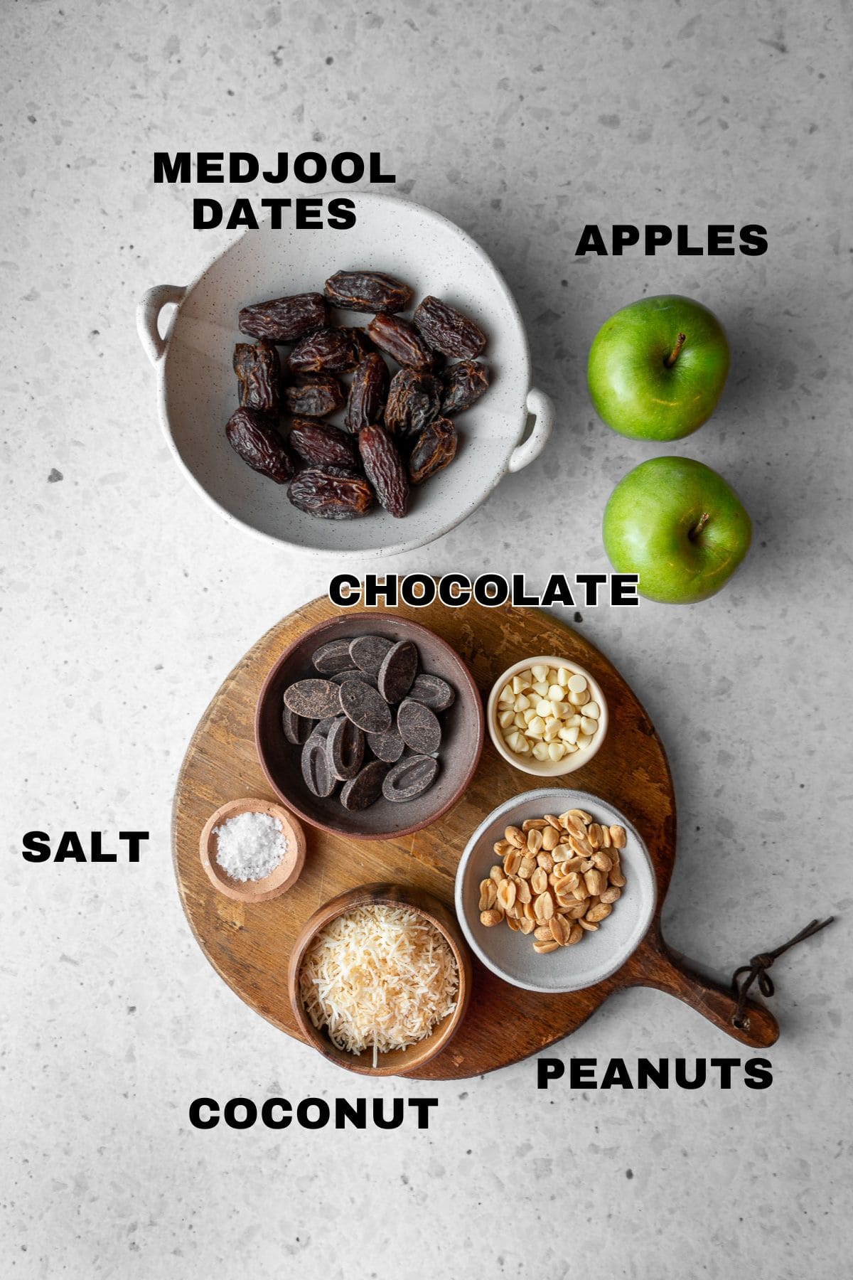 Medjool dates, apples, chocolates, salt, peanuts, and coconut ingredients with labels.