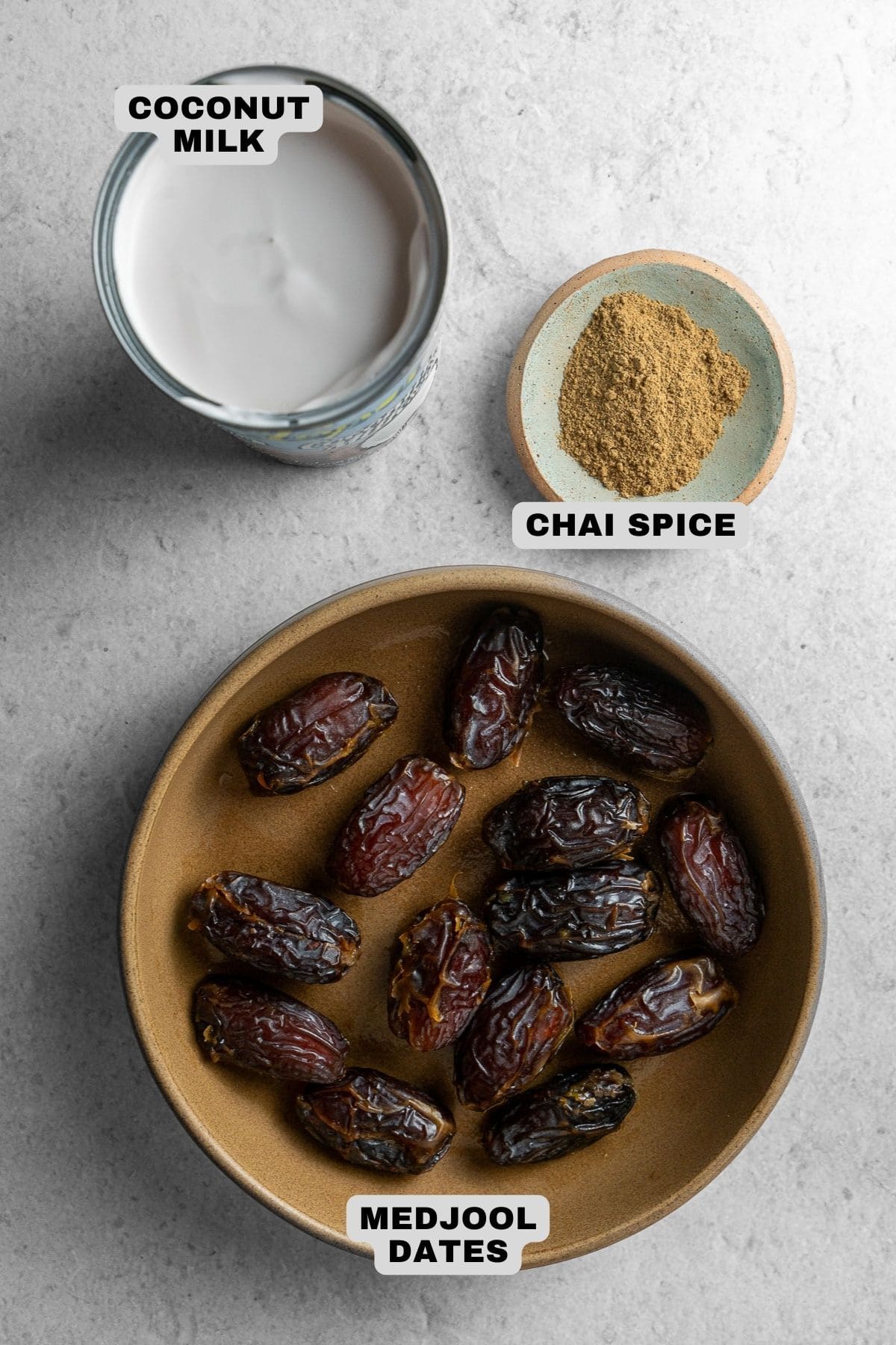 Coconut milk, chai spice, medjool dates ingredients with labels.