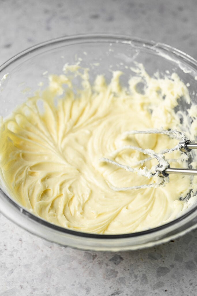 Wet ingredients for a cream cheese cookie in a bowl.