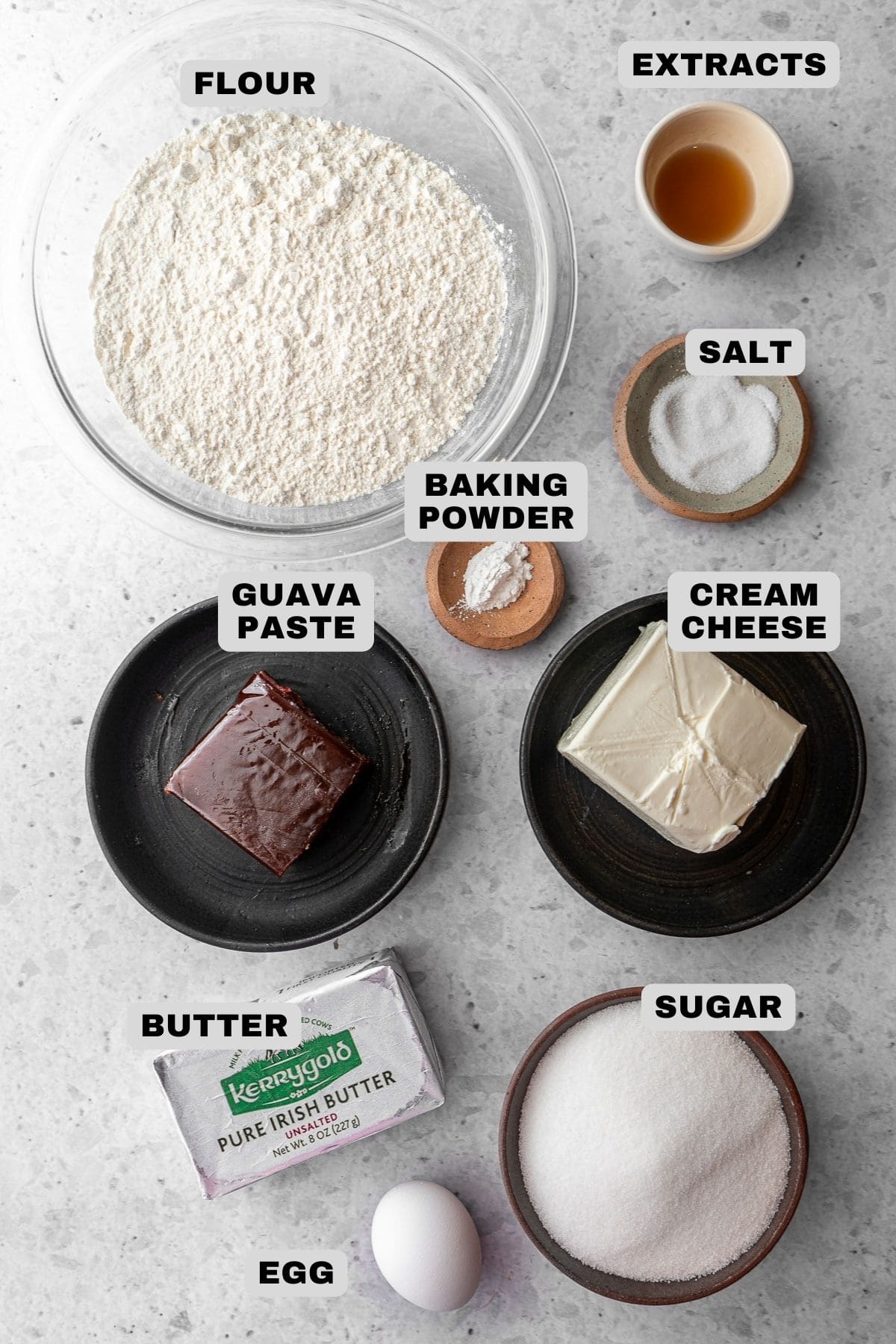 Flour, extracts, salt, baking powder, guava paste, cream cheese, sugar, butter, egg ingredients with labels.
