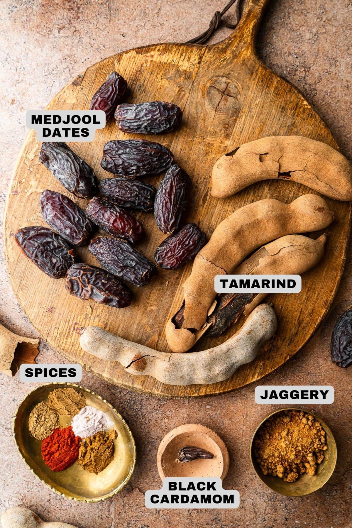 Medjool dates, tamarind, spices, jaggery, and black cardamom ingredients with labels.