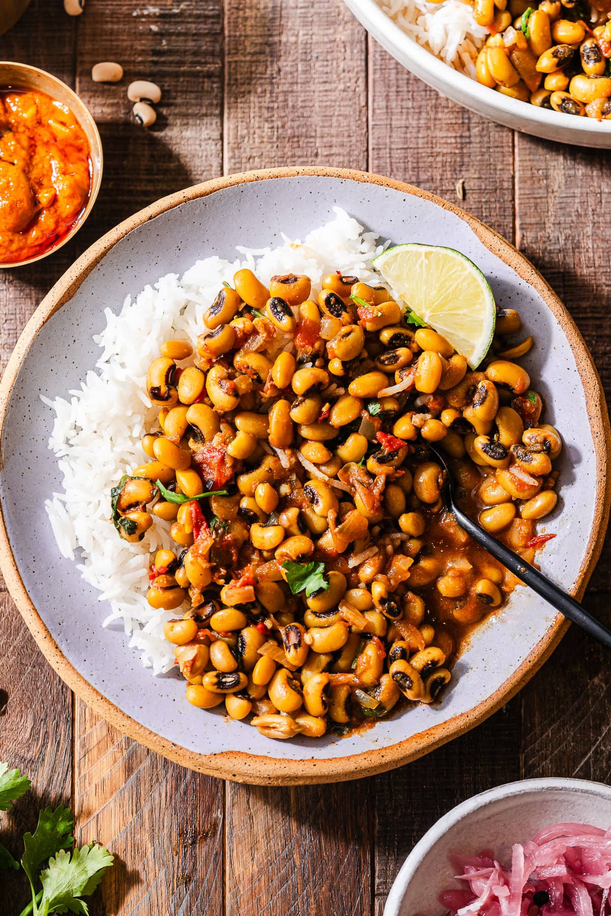 Lobhia Dal served over rice with a lime.