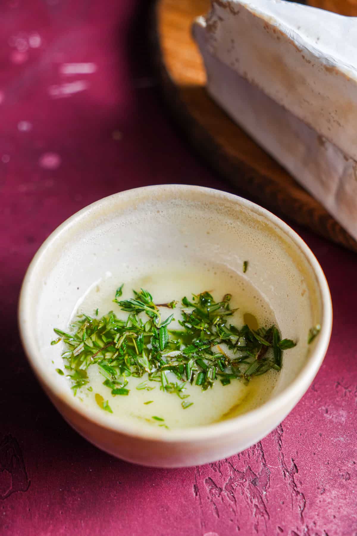 Melted butter with chopped rosemary and thyme.