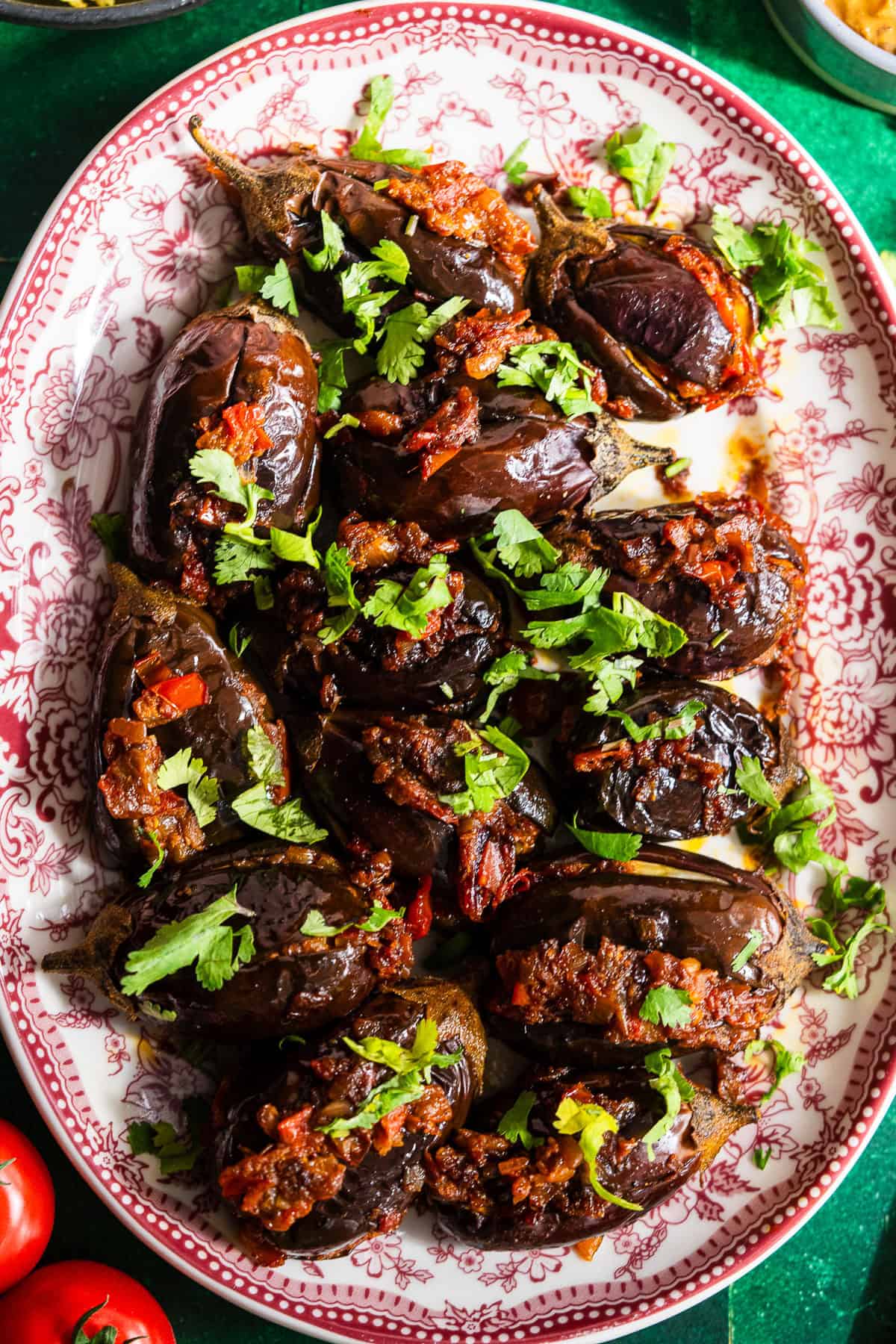 Roasted stuffed eggplant in a platter.
