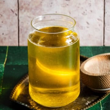 Homemade ghee in a glass jar.