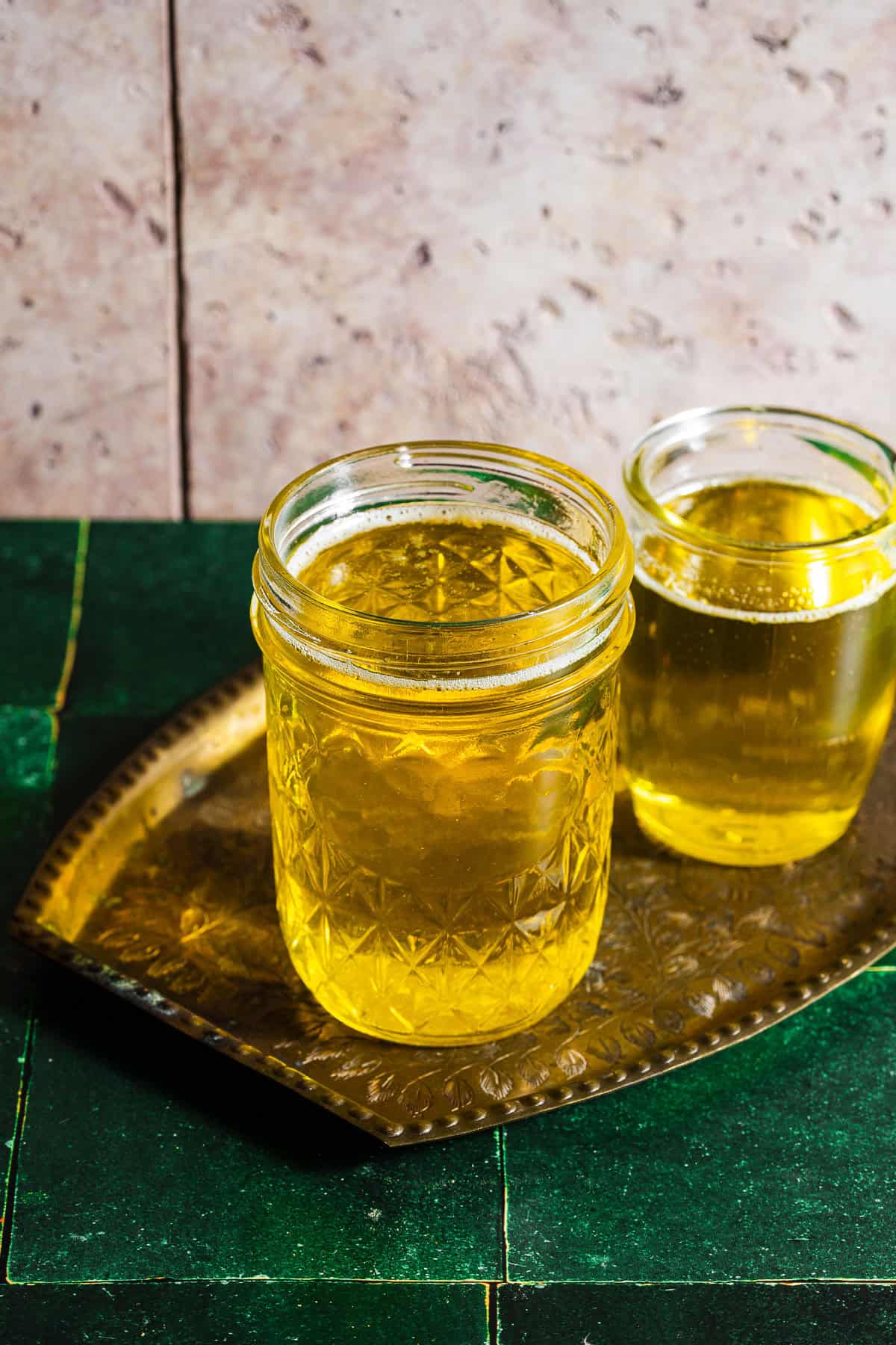 Homemade ghee in glass jars.