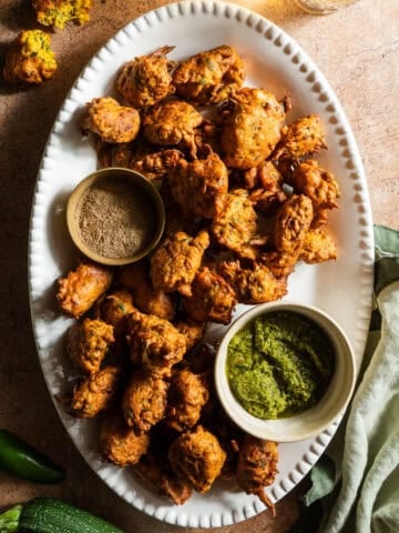 Zucchini fritters in a platter with chutney.