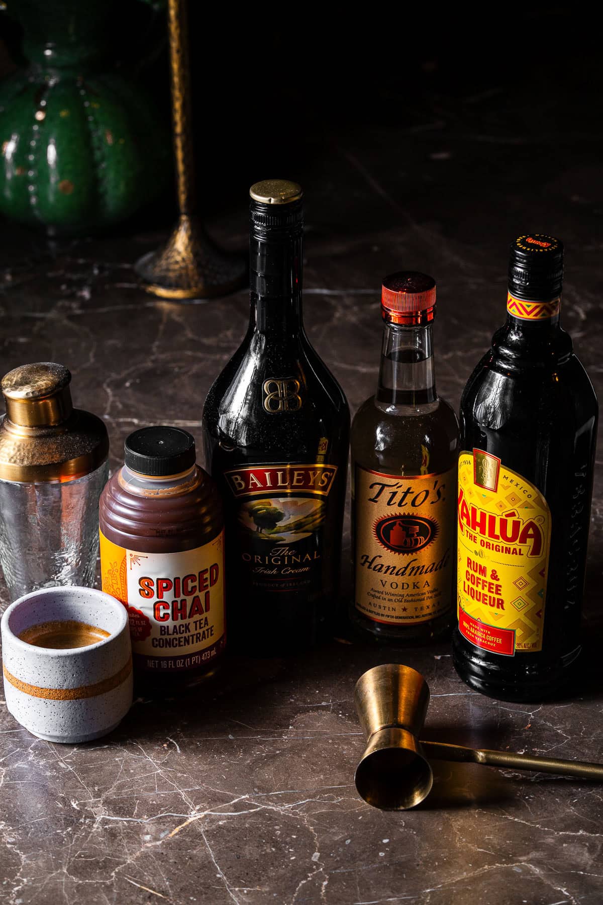 Espresso, spiced chai concentrate, Bailey's, Tito's, and Kahlúa ingredients.