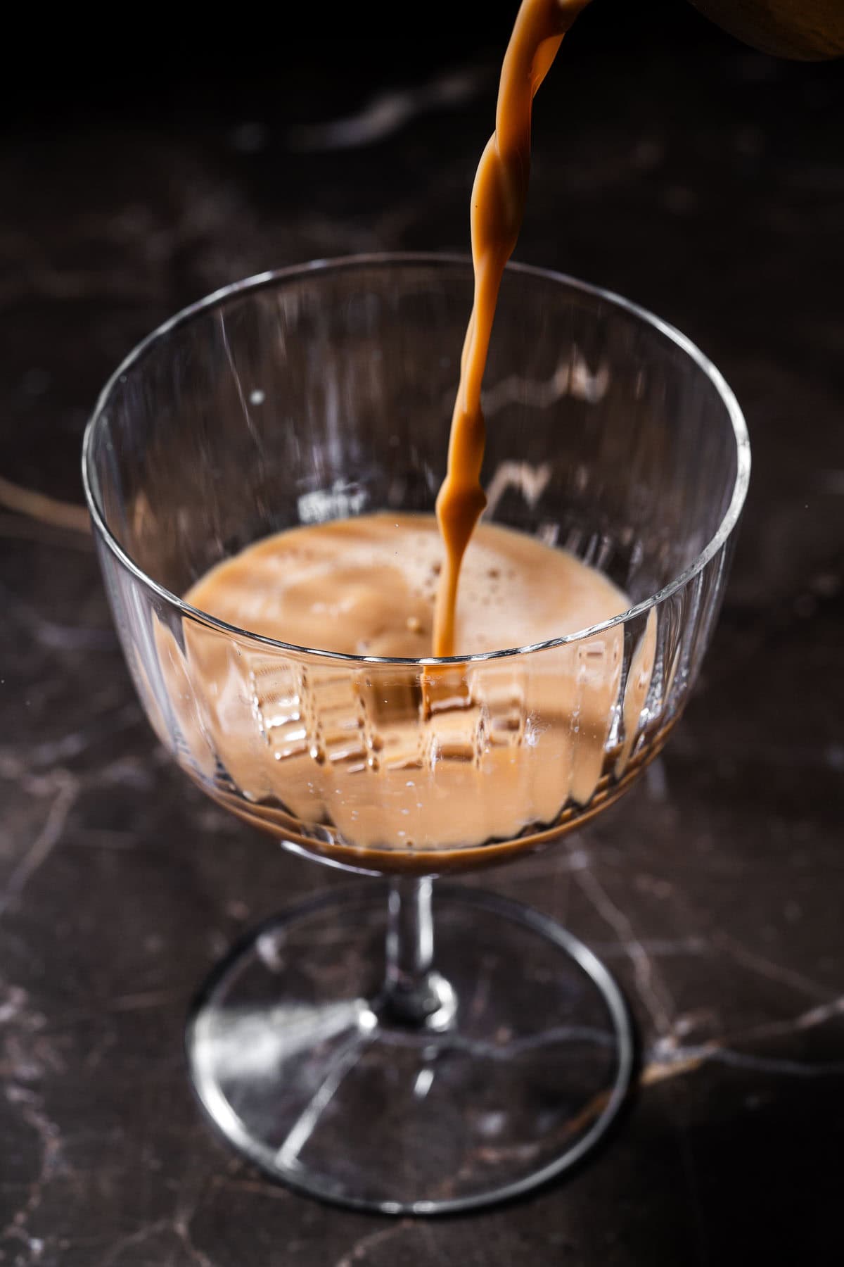 Pour a chai espresso martini in a martini coupe.