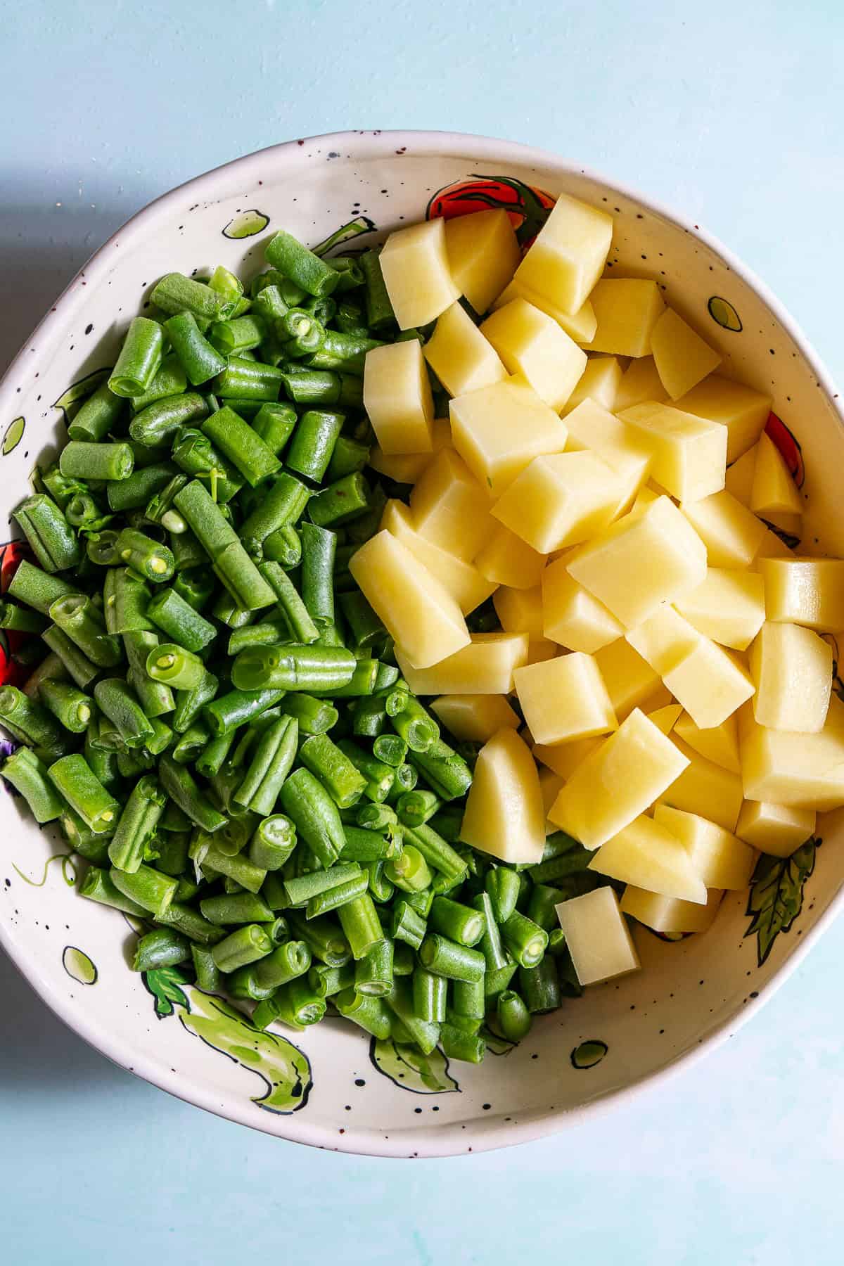 Chopped green beans and potatoes in a bowl.