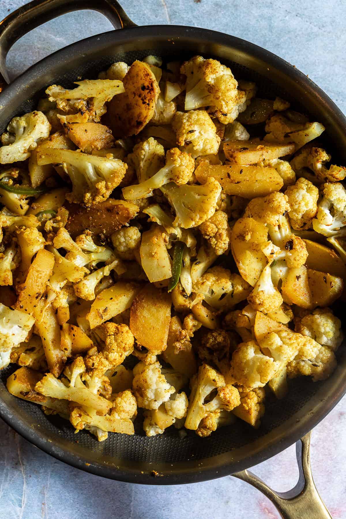 Sauteed potatoes, chilis, and cauliflower.