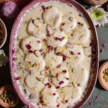 Ras Malai in a platter with fresh roses.
