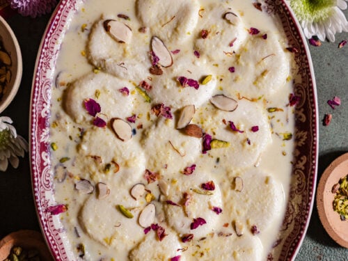 Ras Malai in a platter with fresh roses.