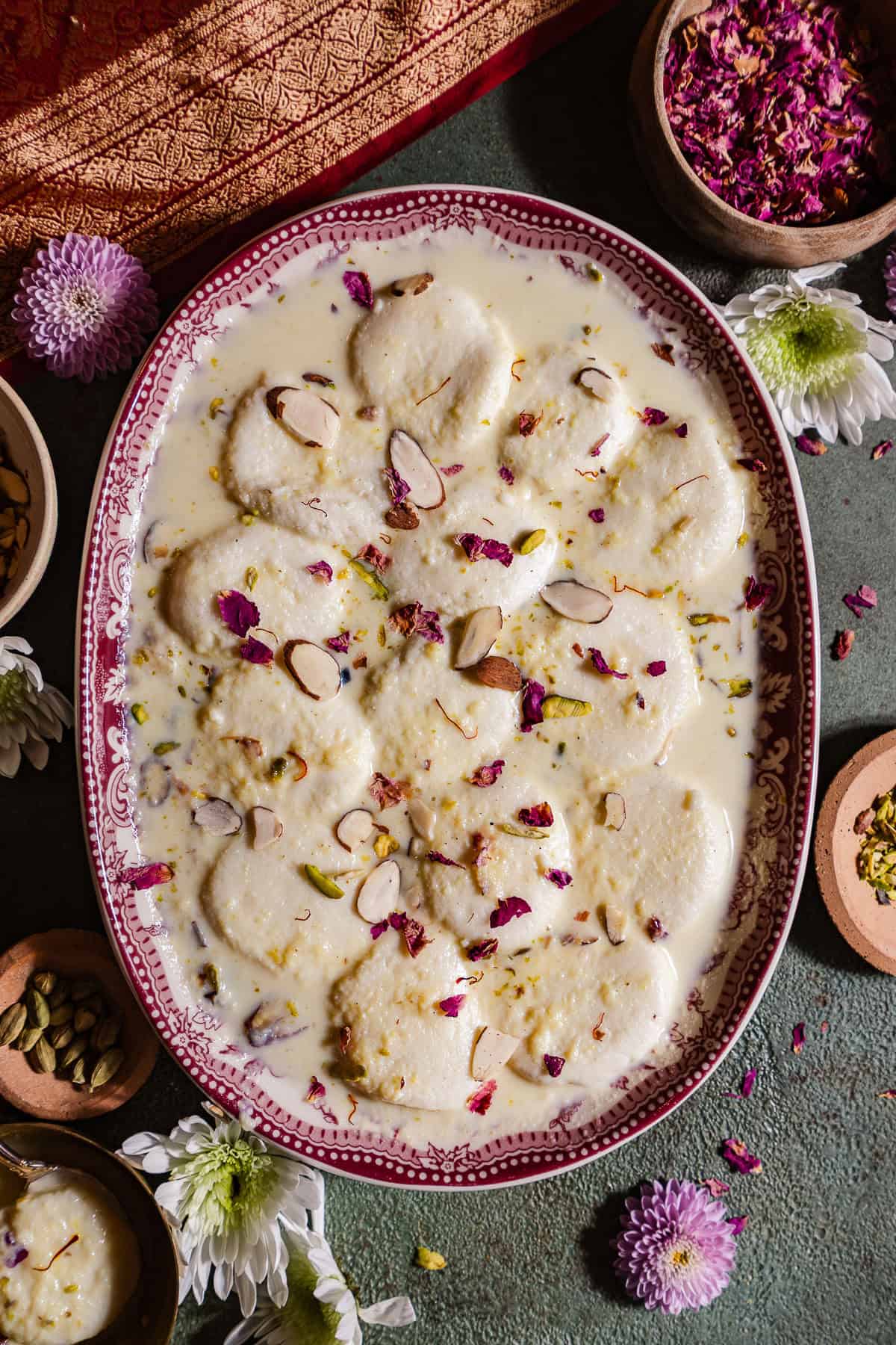 Ras Malai in a platter with fresh roses.