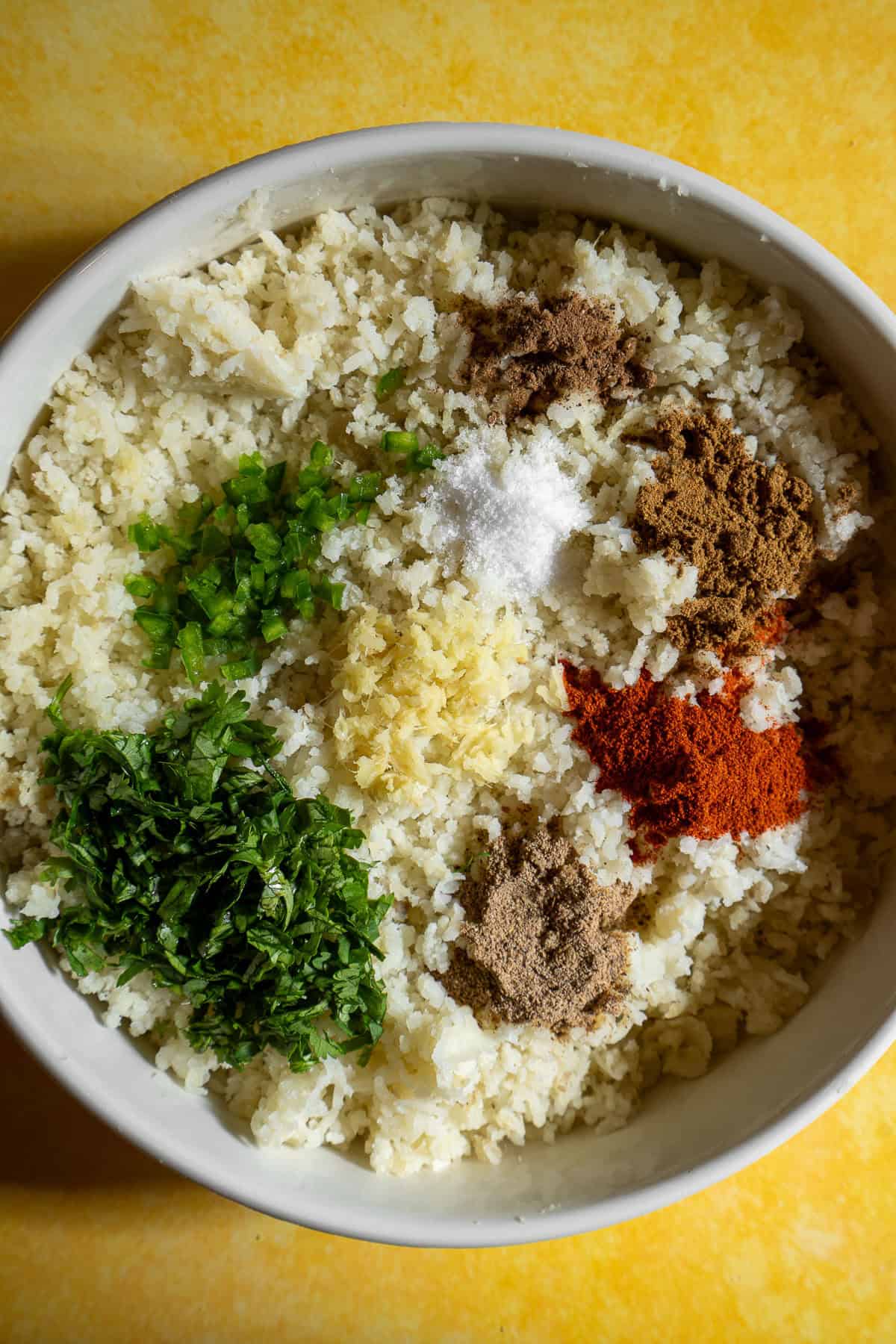 Mashed potatoes topped with cilantro, ginger, chili, and spices.