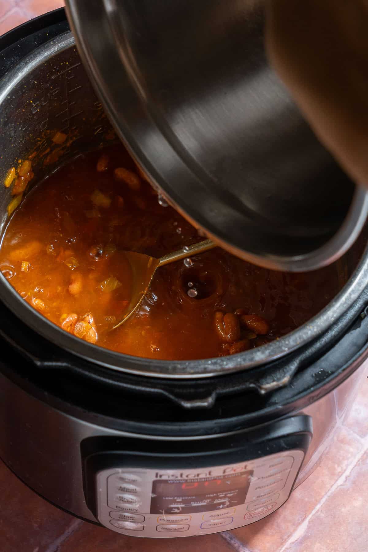 Pour water in with rajma with Instant Pot.