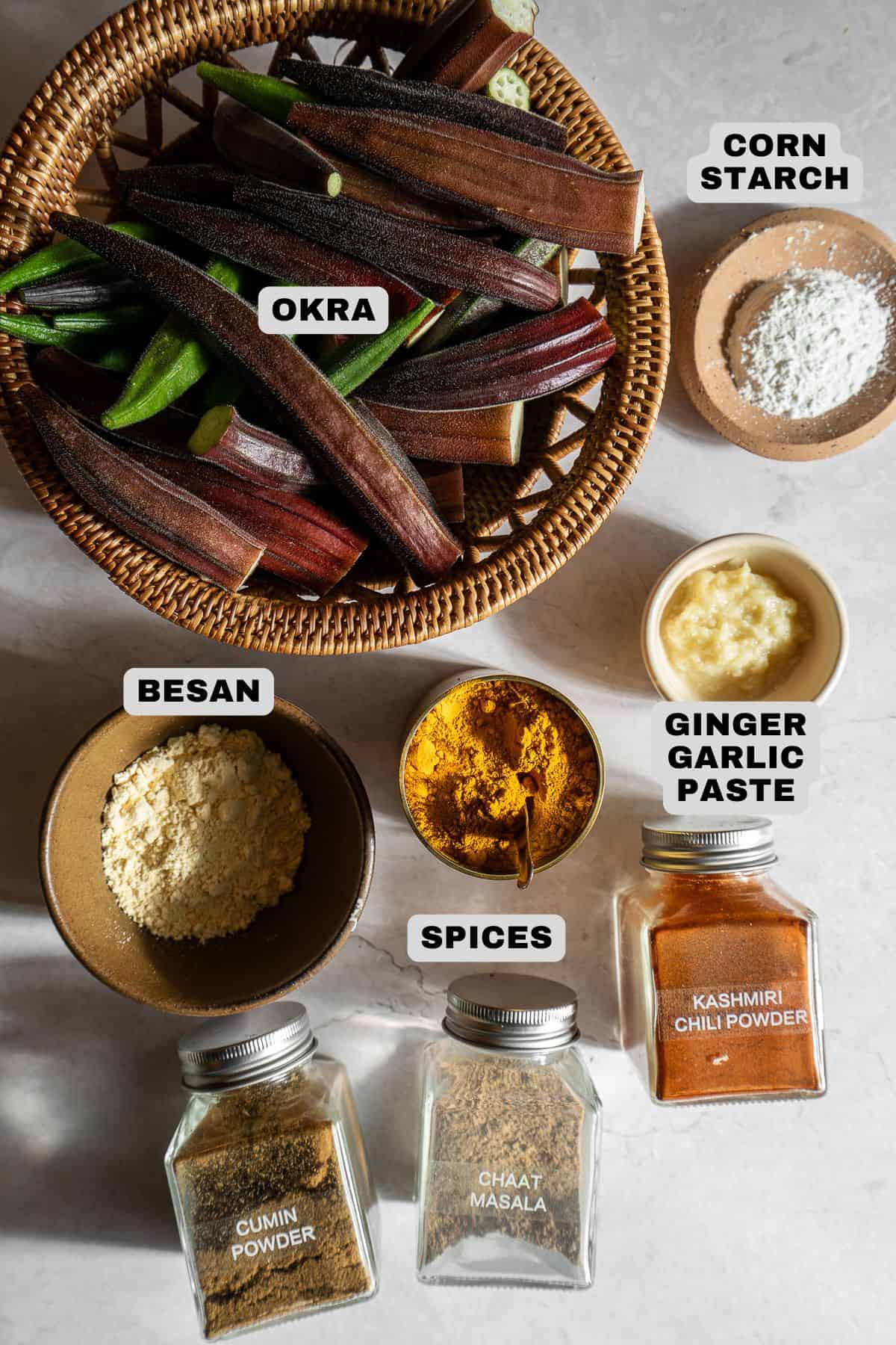 Okra, corn starch, besan, spices, ginger garlic paste ingredients with labels.